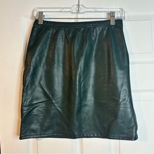 See and Be Seen Dark green mini skirt. Zip up on side.